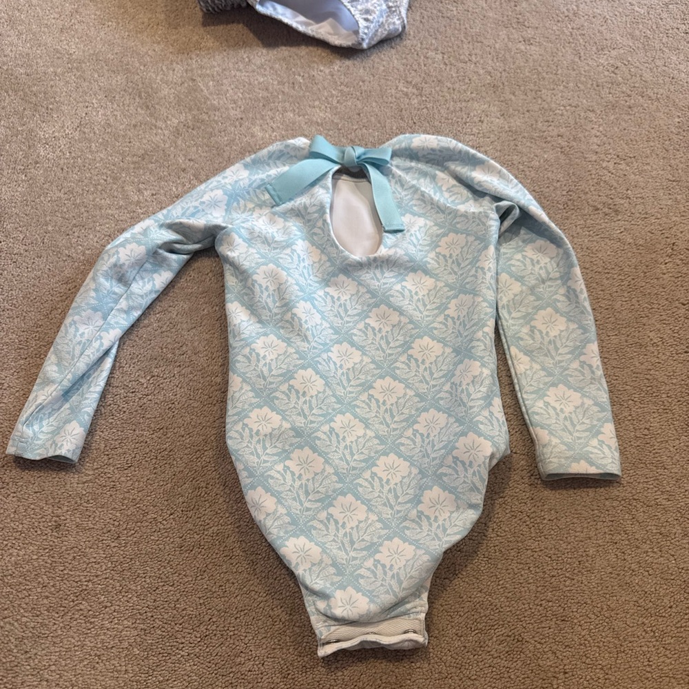 Minnow long sleeve one piece. Light Blue Floral One-Piece Swimsuit with Back Bow